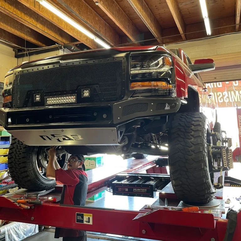 Lifted Chevy Truck Wheel Alignment by Technician